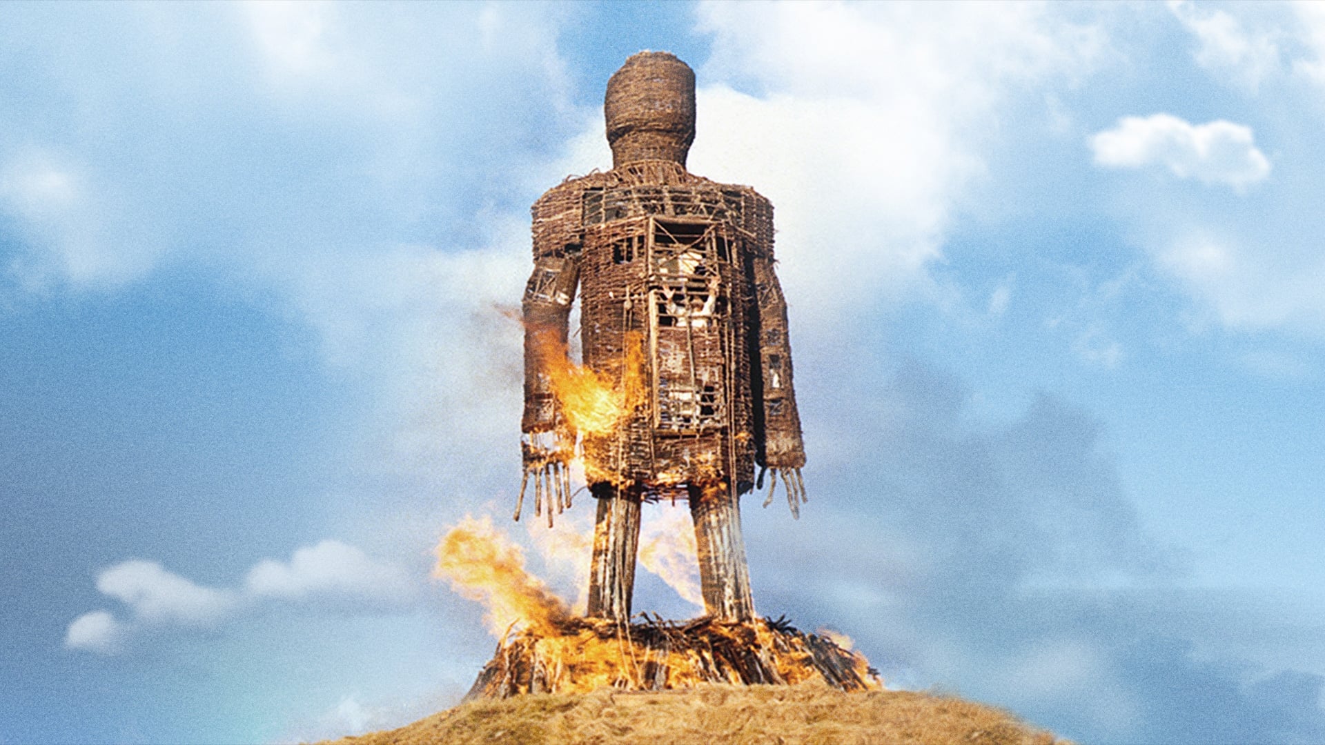 The Wicker Man burning on top of a hill